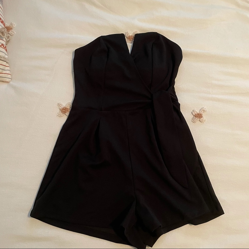 francesca’s black wrap romper with V detailing